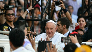 Catholics revel in pope frenzy at Indonesia stadium mass