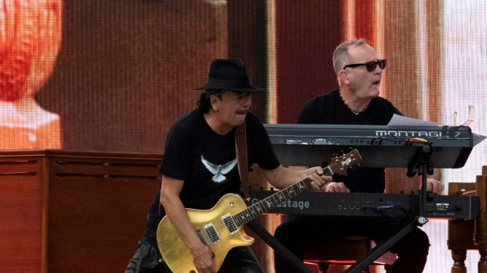 Guitarist Santana collapses on stage after he 'forgot to eat and drink water'