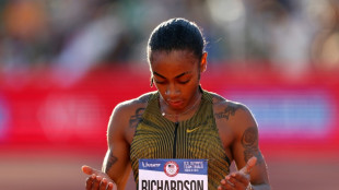 Richardson Olympic double bid over as Lyles marches on
