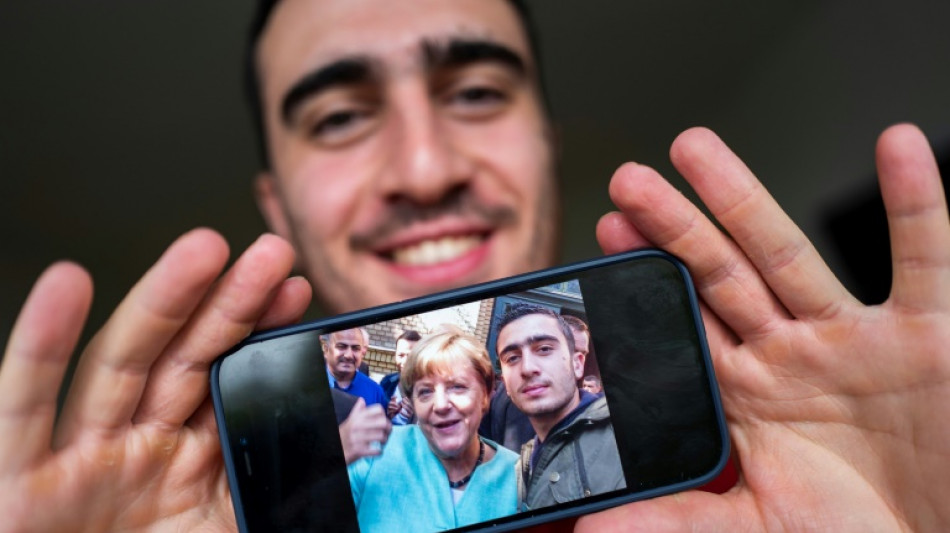 Syrian whose selfie with Merkel went viral wants to stay in Germany