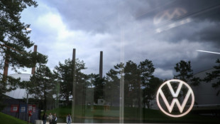 Crisis-hit VW eyeing plant closures, deep pay cuts: report