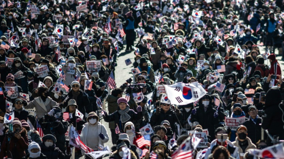 Rival camps protest as South Korea president resists arrest