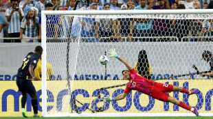 Martinez the shoot-out 'animal' roars again for Argentina