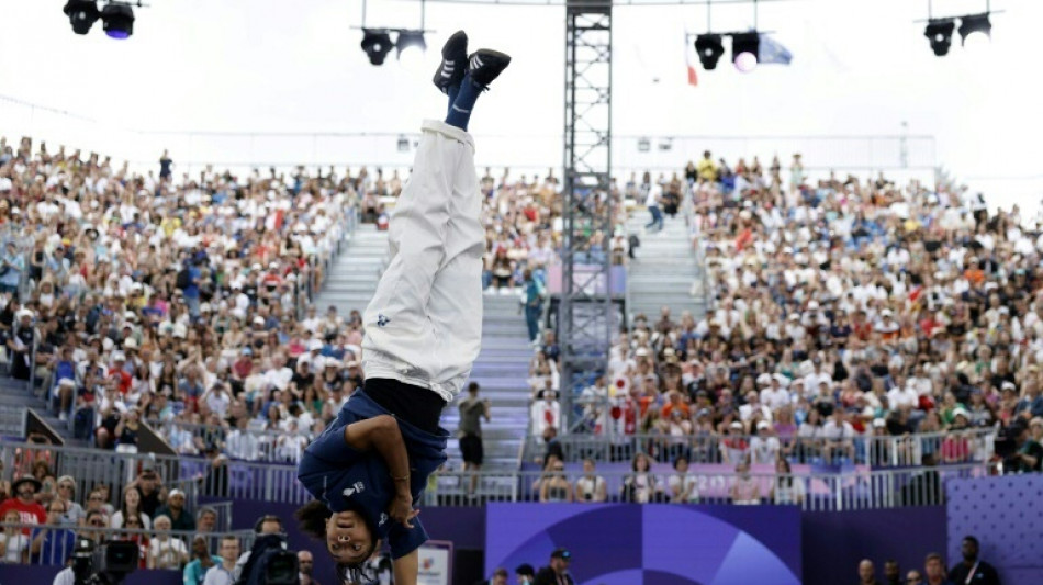 Berliner Tageszeitung Japan's Ami takes gold as breaking makes high