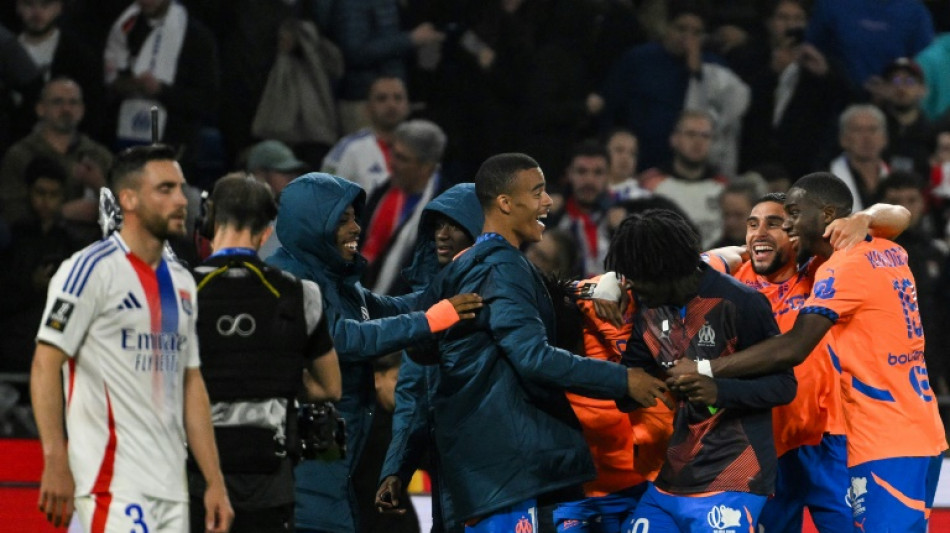 Marseille stun Lyon with 95th-minute winner after early red card